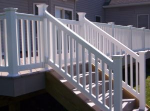 Illusions vinyl deck railings are available as stair rails. Notice that the posts at the top and bottom of the steps are taller than those in the line. This is something to be kept in mind when ordering Illusions vinyl deck railing for stairs.