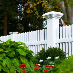 V700 Straight top Classic Victorian picket fence with an 8x8 Majestic post Illusions vinyl fence.