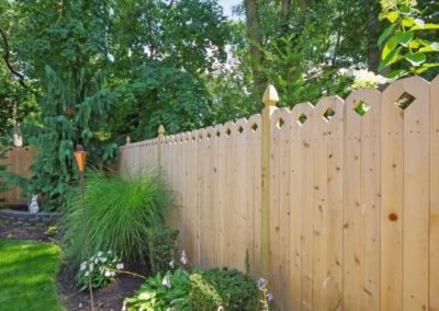 This beautiful Eastern White Cedar fence has a style nine board (1x6 as shown is an up charge - standard boards are 1x4) and is installed on 4x4 treated posts with a Gothic cut top. NOTE: panels that use 2 boards for the shaped top (styles 1,6, 8, 14, 15 and 16) do nt rack well since the boards wil move in relation to one-another. A step installation works much better for these panels.