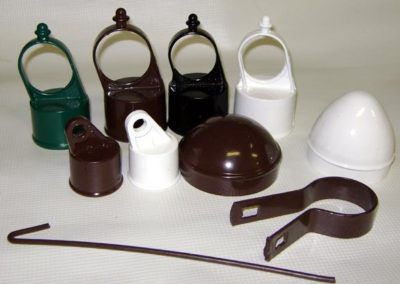 Powder coated color chain link fence fittings shown here are line post tops, rail ends, post caps and a stamped tension band. All are sold by profencesupply.com.