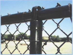 Black powder coated chain link fence framework with black vinyl clad mesh. Mesh is referred to as 'fabric' in the fence industry!
