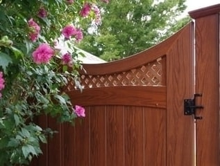 Scalloped top rail, arched mid rail small diagonal lattice topped gate. Be sure to visit the Illusions Vinyl Fence gate page to se all the gate styles.