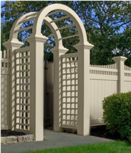 Illusions Vinyl fence Grand Arbor with Old English Lattice sides in Classic Beige on 8x8 Majestic posts.