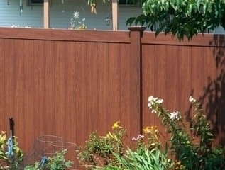 V300-6 - a six foot tall Illusions privacy fence panel in Rosewood wood grain vinyl finish.
